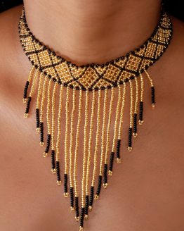 gold and black necklace