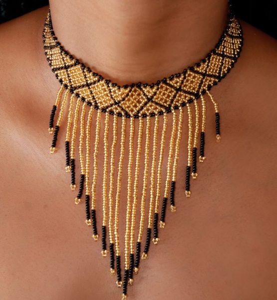 gold and black necklace